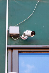Surveillance camera on the wall of the building