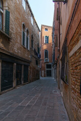 Townscape of a small narrow street with typical facades in Venice, Veneto, Italy