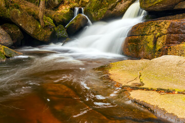 Obraz premium A beautiful view of a romantic stream in a wild mountain valley