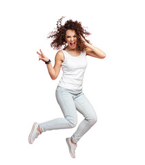 Full length portrait of a joyful young woman jumping and celebrating over transparent  background.