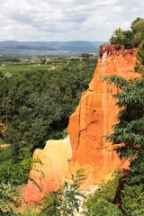 Red ocher cliffs in the village of Roussillon in Provence, France	