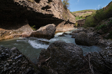 Aksu Canyon with a river in the mountains in Kazakhstan