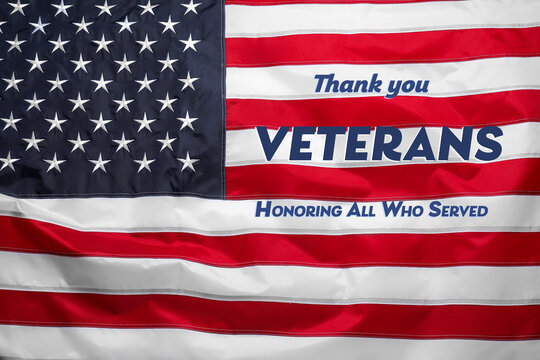 Veterans day. Honoring all who served. American flag as background, closeup