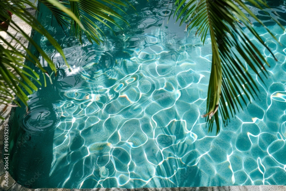 Poster A tranquil pool glistens under the sun with a majestic palm tree standing tall in its center, creating a peaceful and idyllic setting