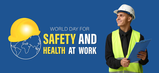 Young male engineer with clipboard on blue background