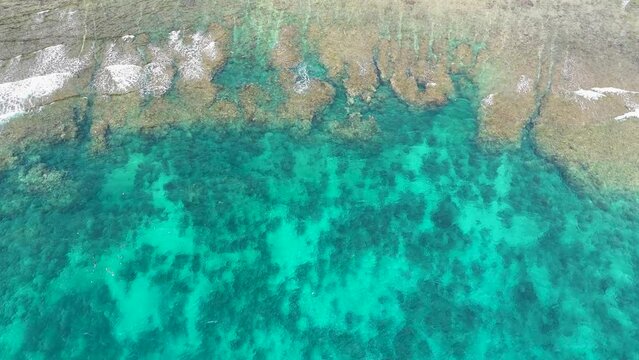 Aerial top down view of ocean and waves Lombok, Indonesia. Bali Sea, Indian ocean. Drone 4K video footage