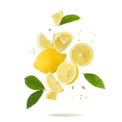 Fototapete Saft Fresh lemon fruit whole and slices with leaves and drops falling flying isolated on white  © BarTa