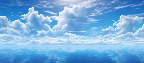 The sky is filled with fluffy clouds casting shadows on the vast expanse of the ocean