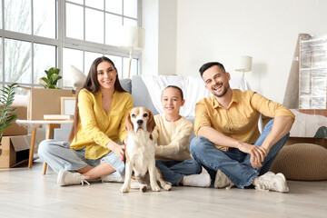 Happy family with Beagle dog sitting in room on moving day - obrazy, fototapety, plakaty