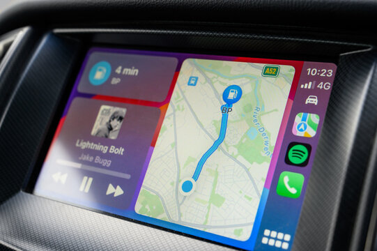 Apple CarPlay system showing Apple Maps with directions for petrol station