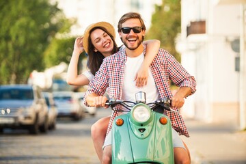 Couple in love riding a motorbike , Handsome guy and young sexy woman travel. Adventure and vacations concept. - 769116656
