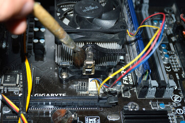Cleaning the computer system unit with a dust brush. system unit maintenance. extending the life of...