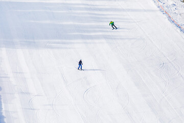 skiers on the early morning slope for skiing and snowboarding. Leisure