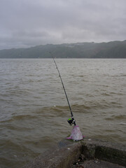 Fishing Rod Off The End Of A Wharf