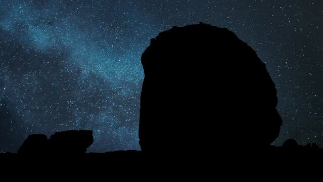 Tomb of Lihyan, son of Kuza carved in rock in the desert, Time Lapse by Night with Stars and Milky Way in Background, Hegra, Saudi Arabia