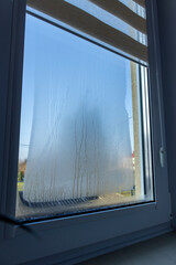 Indoor close-up of a leaky window. Condensate water on window - 769130888