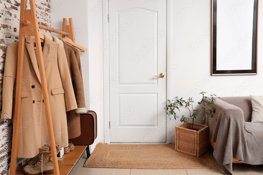 Sticker Interior of hall with white door and clothes rack