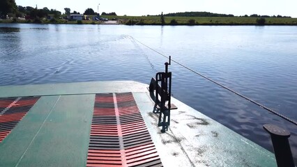 Swibno - Poland. 27 - September, 2021: Busy river boat pushing ferry tramway with people on board