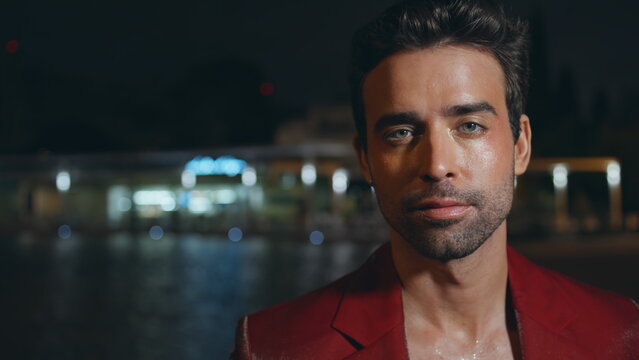 Fototapeta Portrait italian man posing at night street in red jacket. Rich businessman 