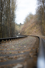 The railroad winds through the valley. Shot flush with the track.