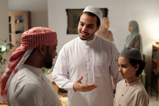 Muslim Man Introducing His Son To Distant Relative