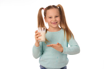 Cute little girl with glass of milk on white background