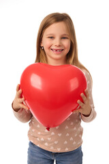 Little girl with heart shaped balloon on white background