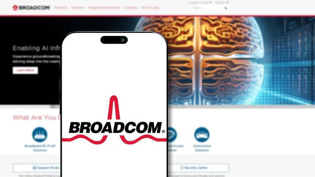 Istanbul, Turkey - 27 March 2024: Broadcom logo on smartphone screen with its website in background. Broadcom is a technology company that designs and supplies semiconductor software solutions