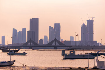 Naklejka premium Boats and cityscpae view in the fisherman's bay in Manama Bahrain