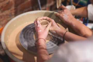 Pottery lesson master class for kids children, process of making clay pot on pottery wheel, potter hands creating ceramic crockery handcrafts, ceramist molding and painting jar or vase