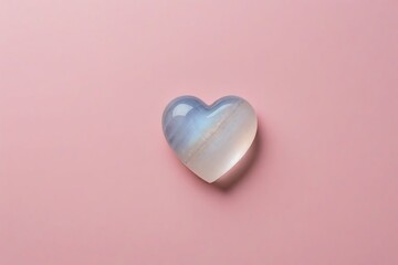 Translucent White Stone Heart on Pink Background: Minimalist Elegance