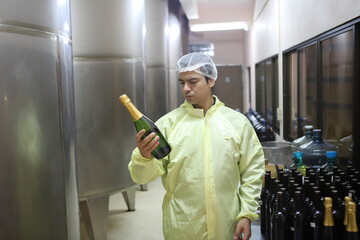 Winemaker working in modern large winery factory drink industry  and  testing wine in a wine factory warehouse - 769180428