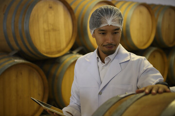 Winemaker working in modern large winery factory drink industry  and  testing wine in a wine factory warehouse - 769182001