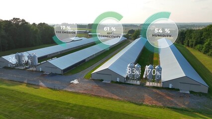 Chicken houses with overlay of data graphics on CO2, humidity, and IoT connectivity. Aerial of...