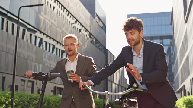 Corporate people commuting morning together. Two men discussing work project