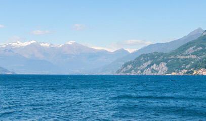 Mountain landscape, picturesque mountain lake in the summer morning, large panorama, landscape with fabulous lake view from the top of the mountain, with view of city. Como, Italy