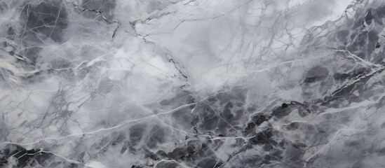 A close up of a monochrome marble texture resembling a freezing winter landscape. The grey and...