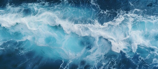 Capturing the beauty of nature, this image showcases a detailed close-up of a wave in the ocean with a serene blue sky in the background - obrazy, fototapety, plakaty