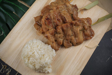 Grilled pork with sticky rice. (Moo Ping ) Thai popular for breakfast street food. Appetizer menu