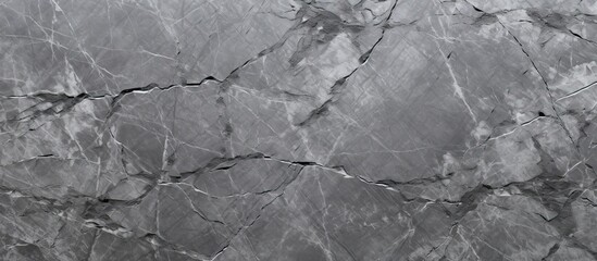 A close up of a gray marble texture resembling water ripples on a calm pond. The monochrome photography captures the intricate details of the landscape