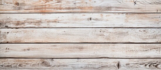A closeup shot of a brown hardwood rectangular table made of parallel wooden planks. The background is blurred, showcasing the beauty of the building material