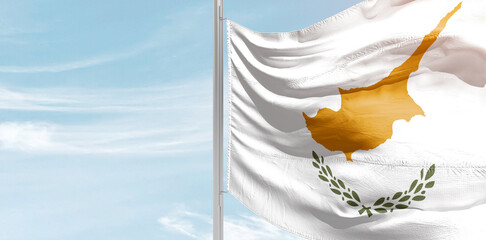 Cyprus national flag with mast at light blue sky. - obrazy, fototapety, plakaty