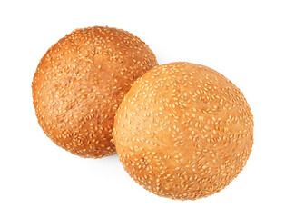 Fresh hamburger buns with sesame seeds isolated on white, top view