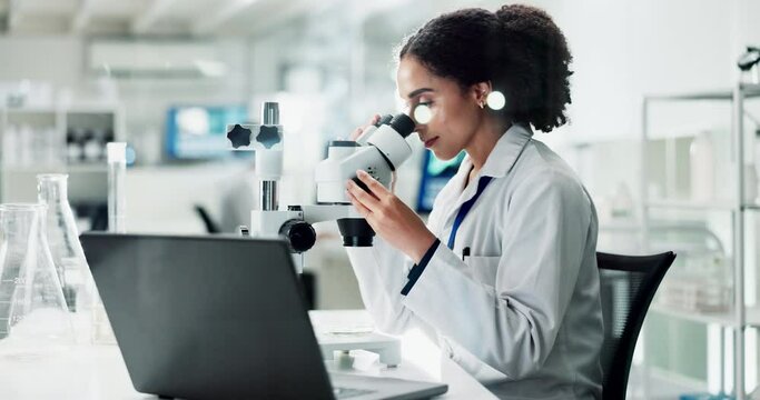 African woman, microscope and laboratory for science with laptop, thinking and check for results. Person, scientist and data analysis for sample, bacteria or particles with computer in lab with ideas