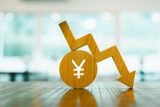 Yen symbol model and down arrow  concepts of systems of raising or lowering Fed interest rates, Japan's economy,  The problem of the depreciating yen continuously.