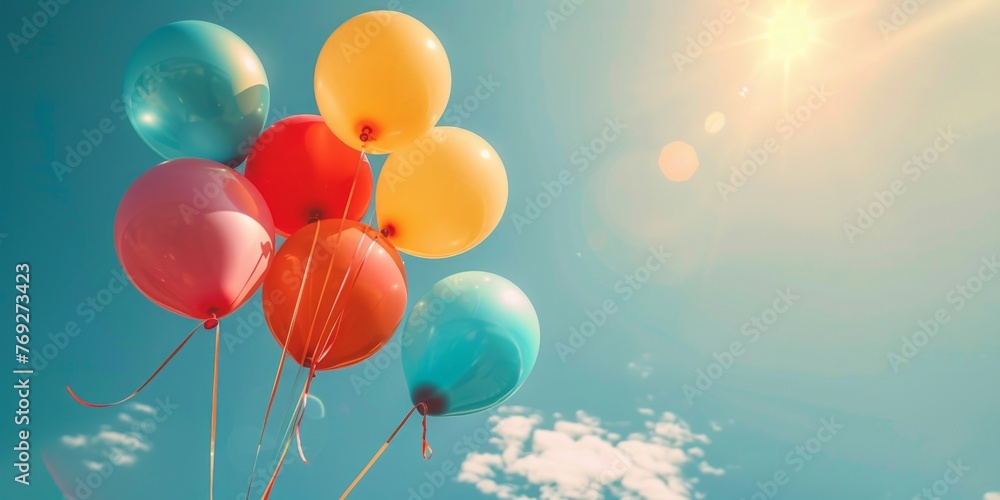 Poster a group of colorful balloons floating effortlessly in the sky.