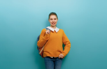 teenager on color paper wall background