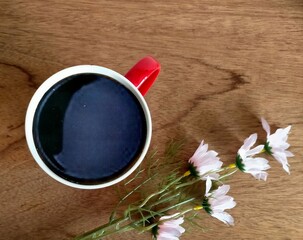 cup of coffee with flowers