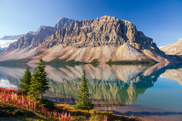 Beautiful picturesque morning lake surrounded by majestic rocky mountains. Bow Lake, Banff National...