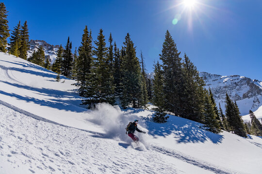 Splitboarding woman in the backcountry of Colorado